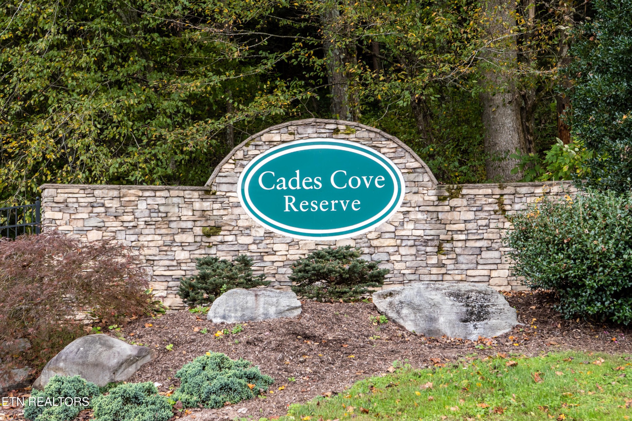 229 Bishops Cap Circle, Unit 101 Townsend, TN 37882 - Photo 2 of 47 a sign that is on a brick wall