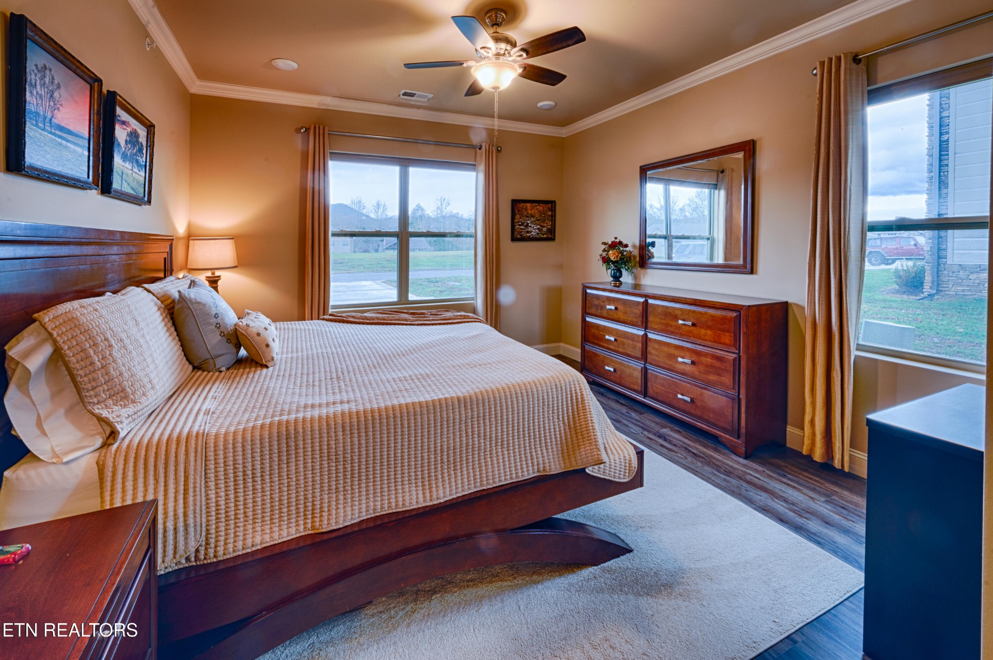 229 Bishops Cap Circle, Unit 101 Townsend, TN 37882 - Photo 21 of 47 a bedroom with a large bed and a dresser