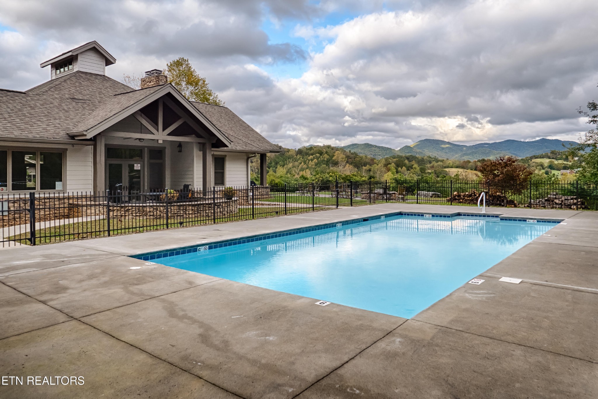 229 Bishops Cap Circle, Unit 101 Townsend, TN 37882 - Photo 4 of 47 a view of a house with swimming pool and sitting area