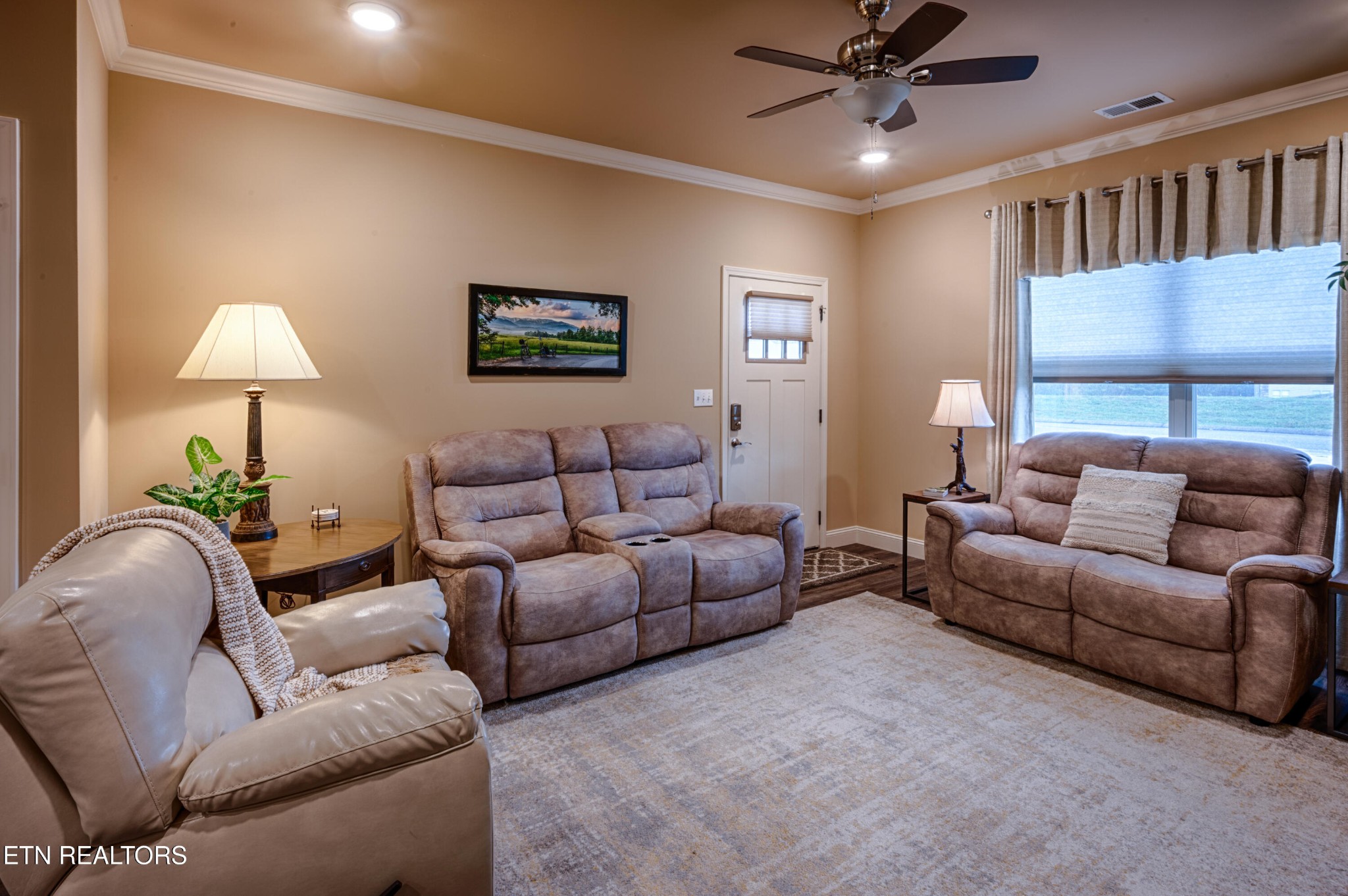 229 Bishops Cap Circle, Unit 101 Townsend, TN 37882 - Photo 7 of 47 a living room with furniture a lamp and a window