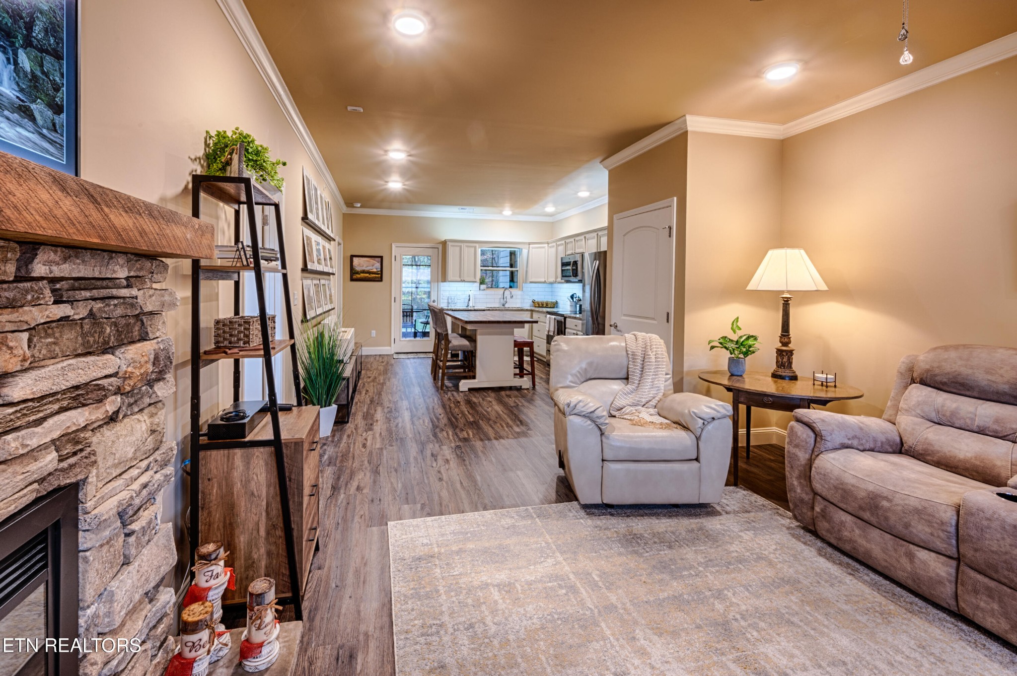 229 Bishops Cap Circle, Unit 101 Townsend, TN 37882 - Photo 9 of 47 a living room with furniture and a wooden floor