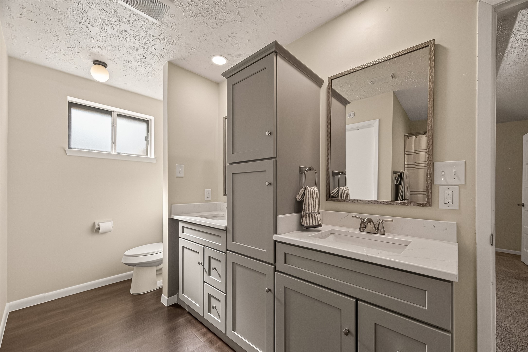 555 Shealy Street Houston, TX 77598 - Photo 28 of 41 a bathroom with a sink a toilet and a large mirror