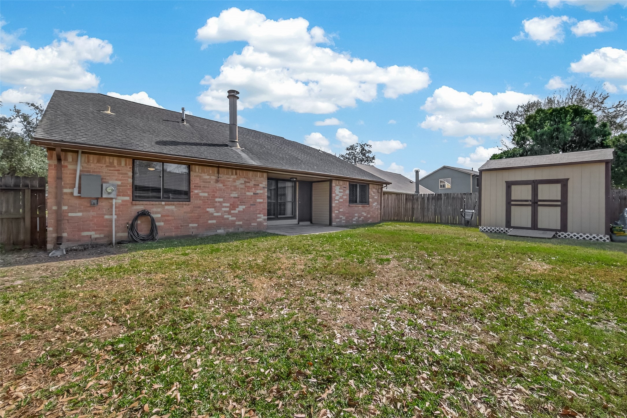 555 Shealy Street Houston, TX 77598 - Photo 31 of 41 a front view of a house with a garden