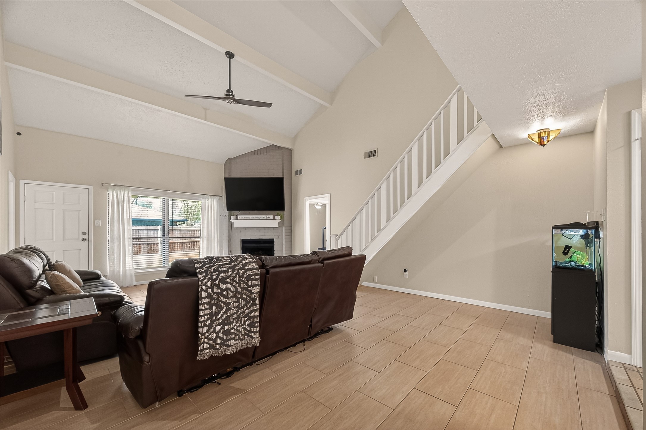 555 Shealy Street Houston, TX 77598 - Photo 8 of 41 a living room with furniture and a flat screen tv