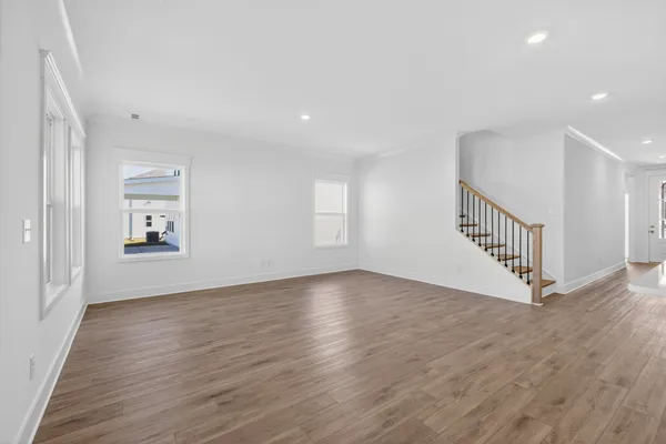 a view of a kitchen with wooden floor