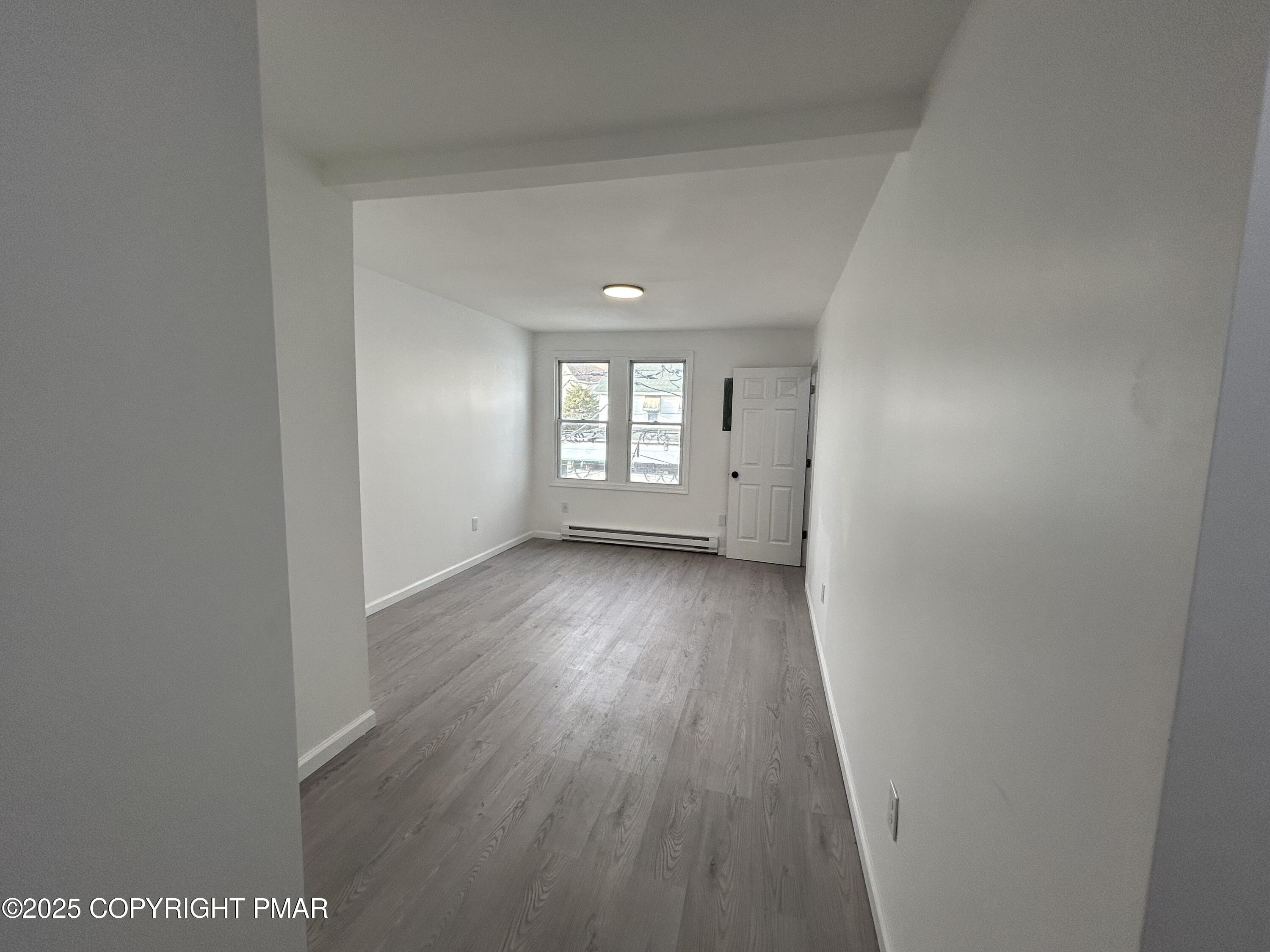 222 East Patterson Street, Unit 4 Lansford, PA 18232 - Photo 2 of 16 a view of empty room with wooden floor and fan