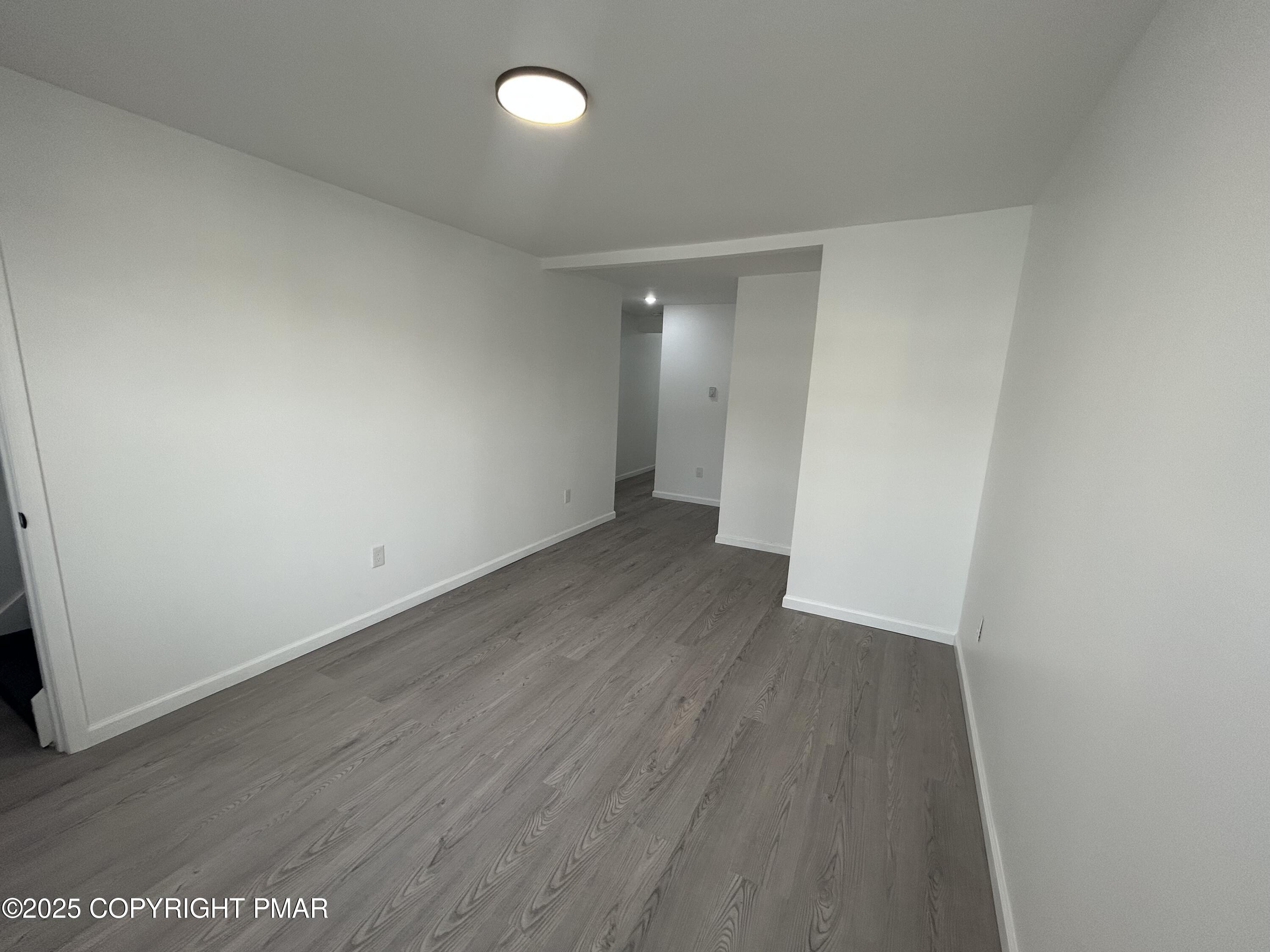 222 East Patterson Street, Unit 4 Lansford, PA 18232 - Photo 3 of 16 an empty room with wooden floor and entrance