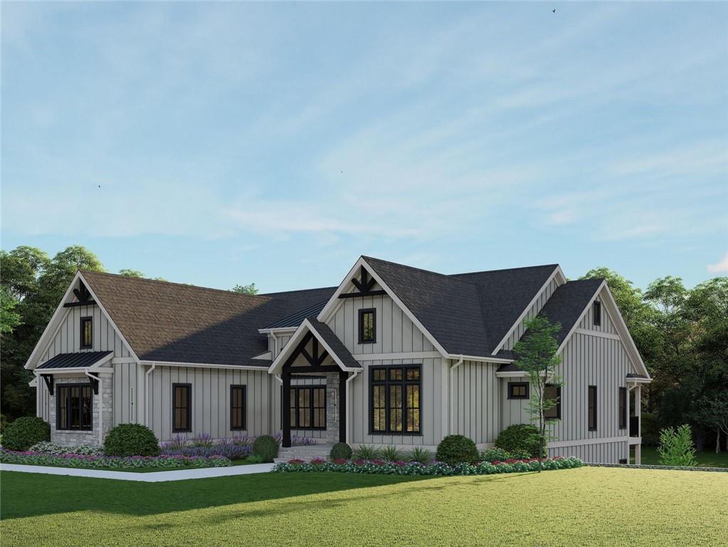 2468 Rockbridge Road Northwest Conyers, GA 30012 - Photo 2 of 8 a front view of a house with a garden and plants