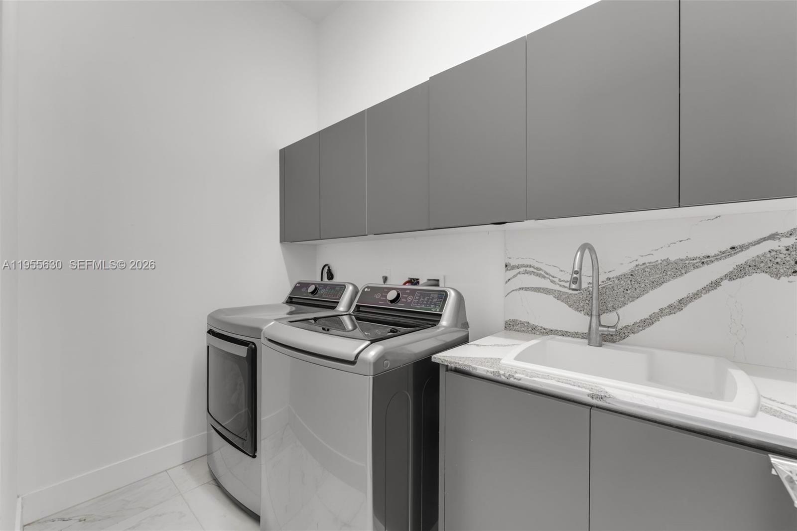 4950 Southwest 158th Ave Ranches Southwest Ranches, FL 33331 - Photo 18 of 75 a utility room with dryer and washer