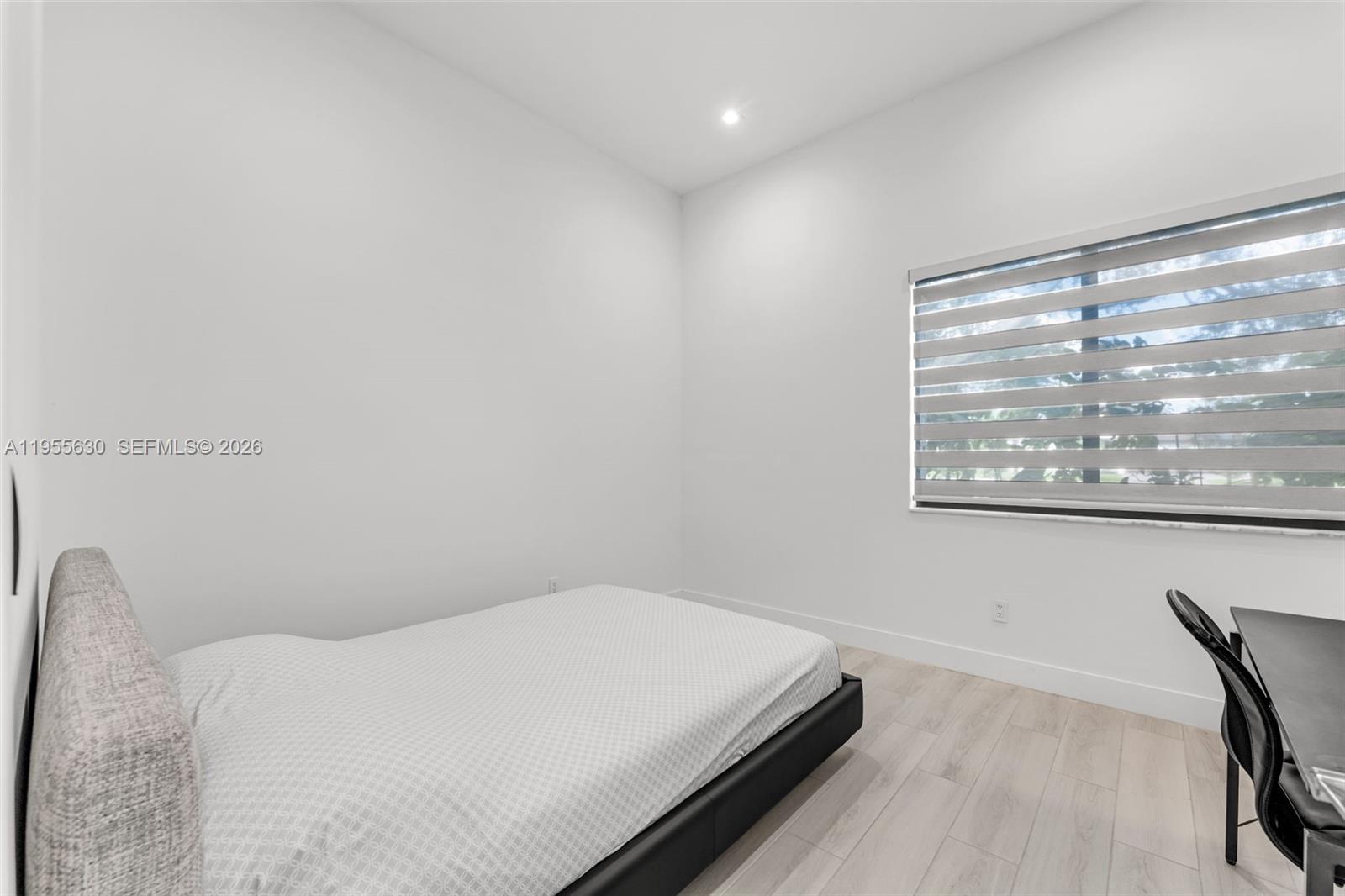 4950 Southwest 158th Ave Ranches Southwest Ranches, FL 33331 - Photo 24 of 75 a bedroom with a bed and a window