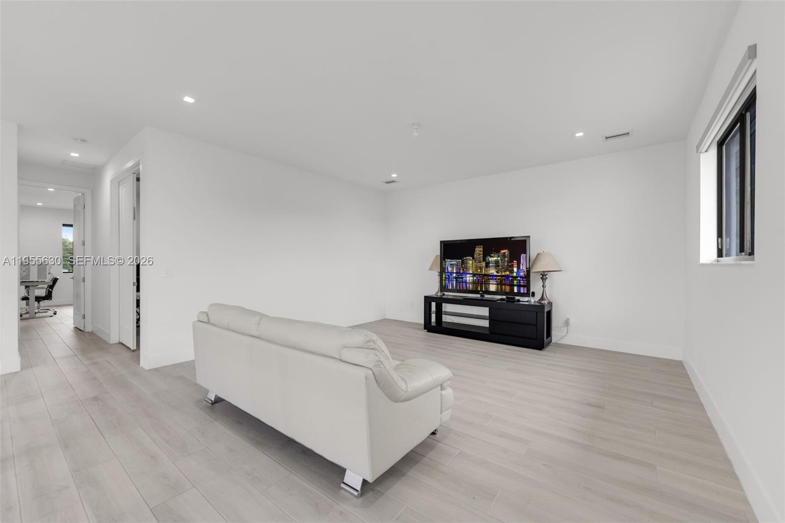 4950 Southwest 158th Ave Ranches Southwest Ranches, FL 33331 - Photo 29 of 75 a living room with furniture and a flat screen tv