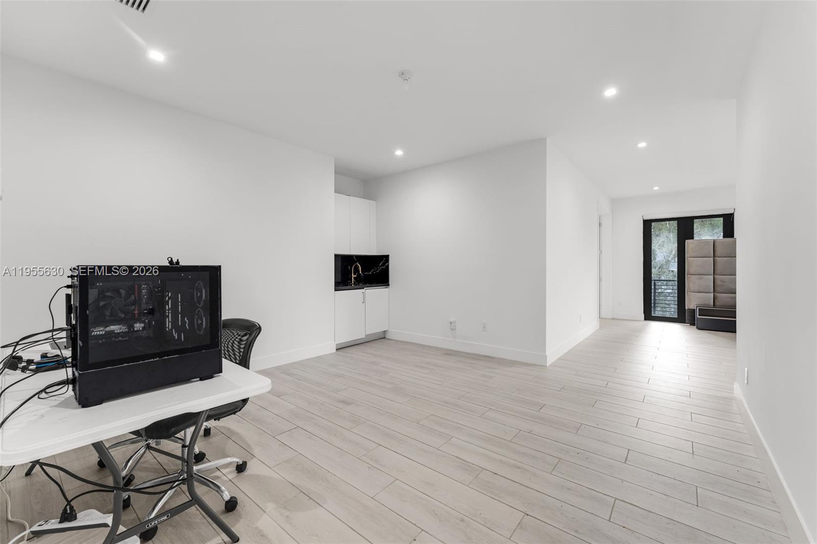 4950 Southwest 158th Ave Ranches Southwest Ranches, FL 33331 - Photo 31 of 75 a living room with furniture and wooden floor