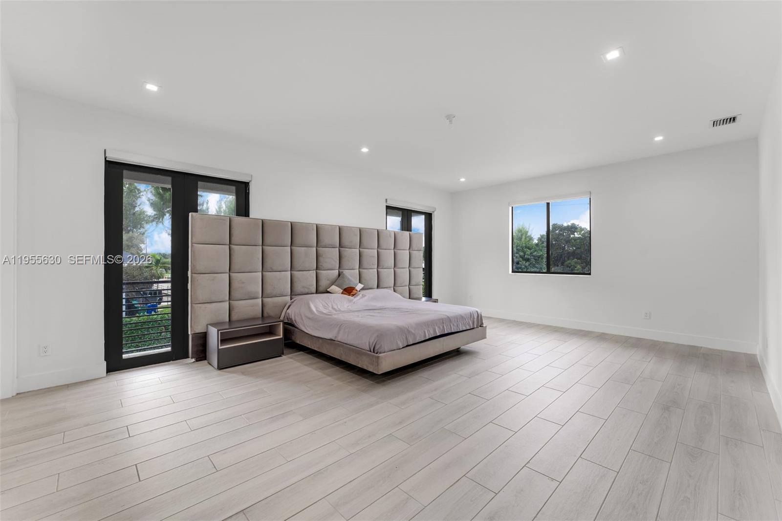 4950 Southwest 158th Ave Ranches Southwest Ranches, FL 33331 - Photo 33 of 75 a living room with furniture and a wooden floor