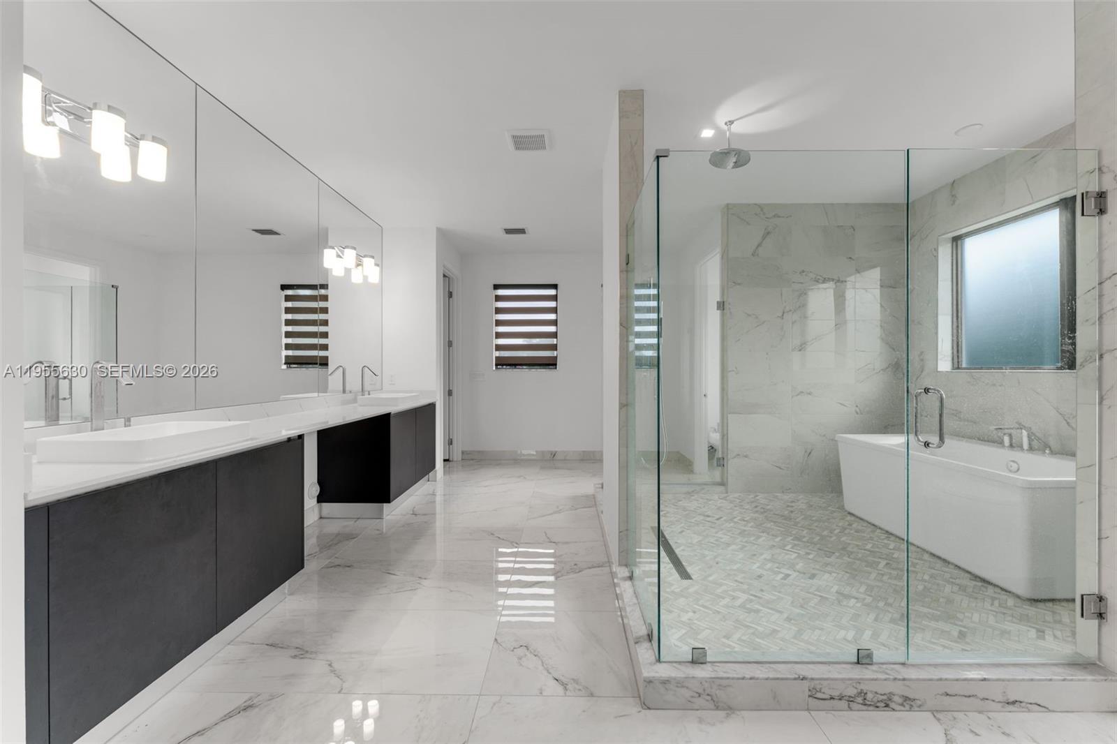 4950 Southwest 158th Ave Ranches Southwest Ranches, FL 33331 - Photo 36 of 75 a bathroom with a granite countertop sink mirror and shower