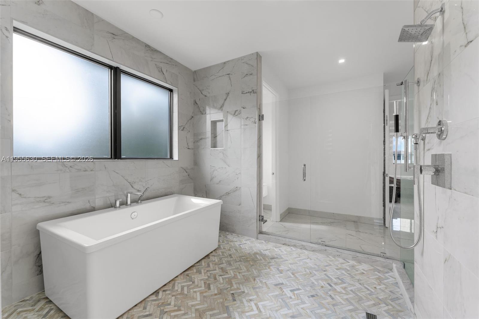 4950 Southwest 158th Ave Ranches Southwest Ranches, FL 33331 - Photo 39 of 75 a bathroom with a bathtub and a sink