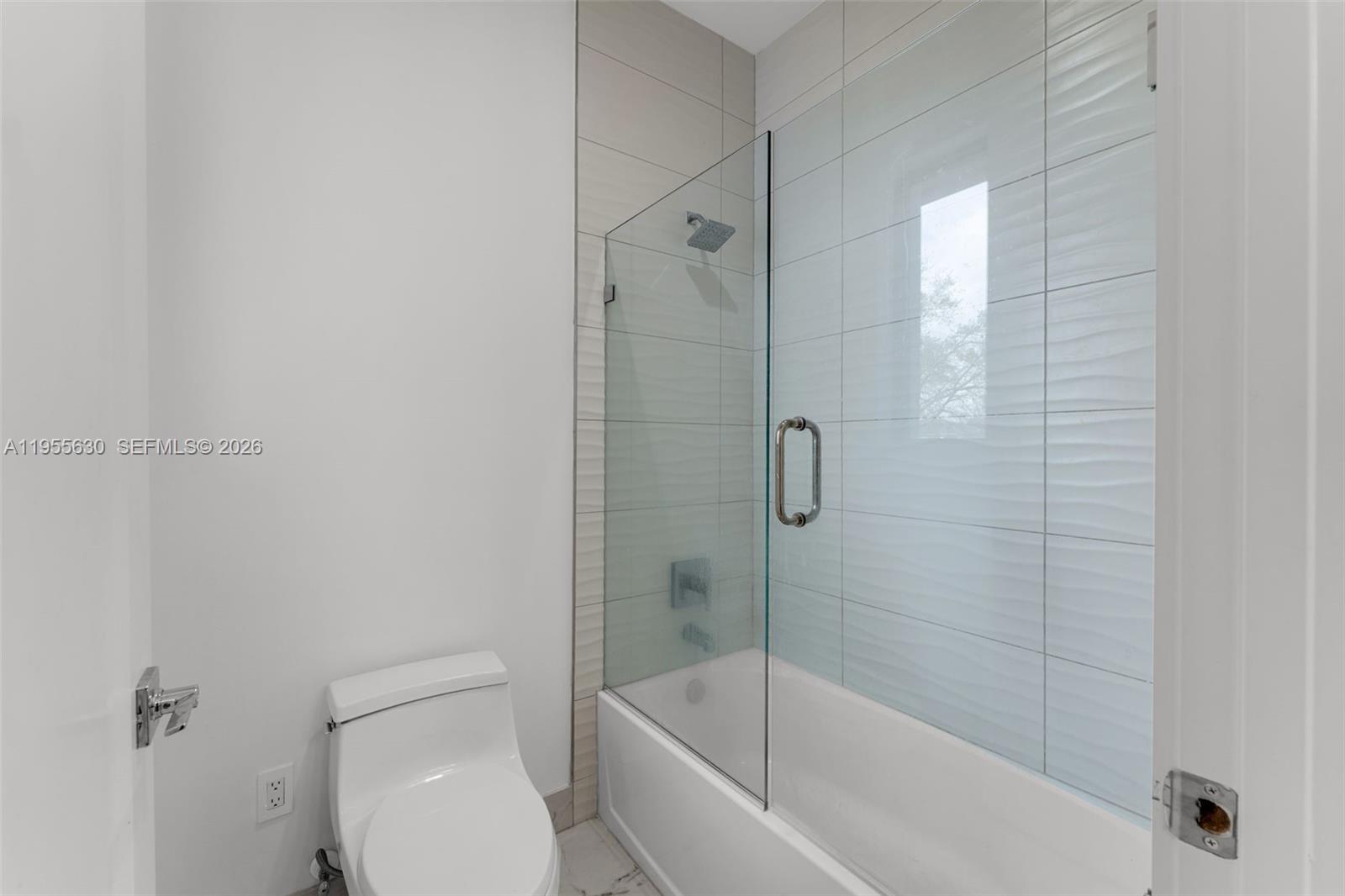 4950 Southwest 158th Ave Ranches Southwest Ranches, FL 33331 - Photo 49 of 75 a bathroom with a bathtub and a toilet