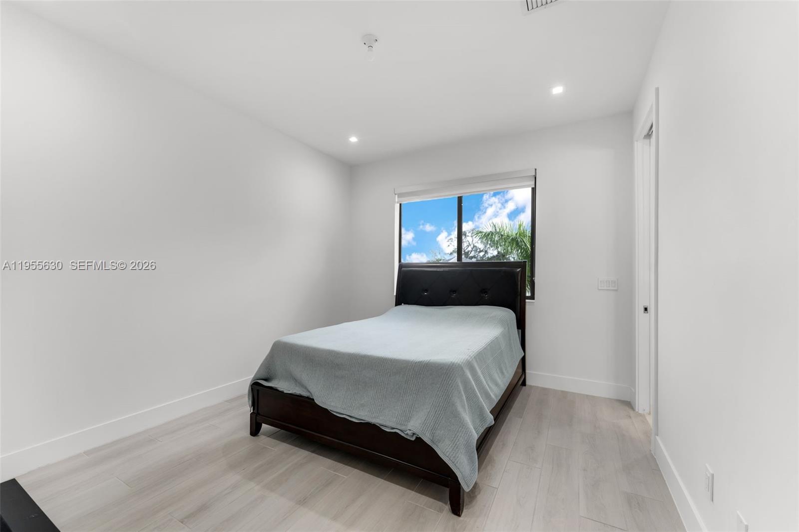 4950 Southwest 158th Ave Ranches Southwest Ranches, FL 33331 - Photo 50 of 75 a bedroom with a bed and window