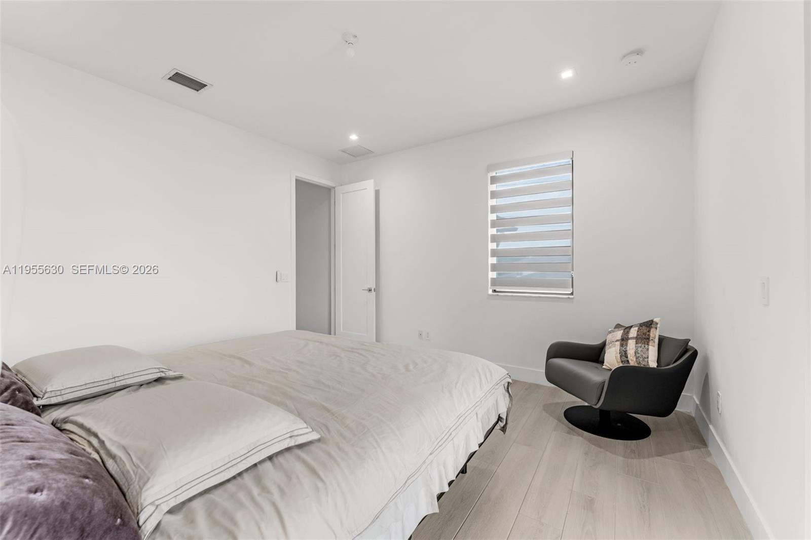 4950 Southwest 158th Ave Ranches Southwest Ranches, FL 33331 - Photo 53 of 75 a bedroom with a bed and a couch