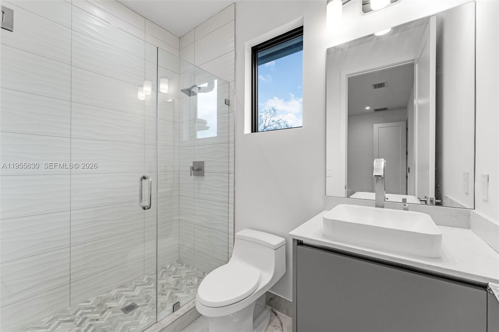 4950 Southwest 158th Ave Ranches Southwest Ranches, FL 33331 - Photo 54 of 75 a bathroom with a sink toilet and shower