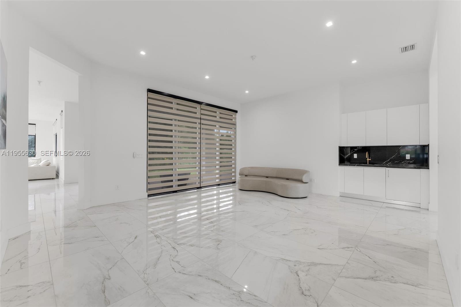 4950 Southwest 158th Ave Ranches Southwest Ranches, FL 33331 - Photo 6 of 75 a view of an empty room with furniture and utility room