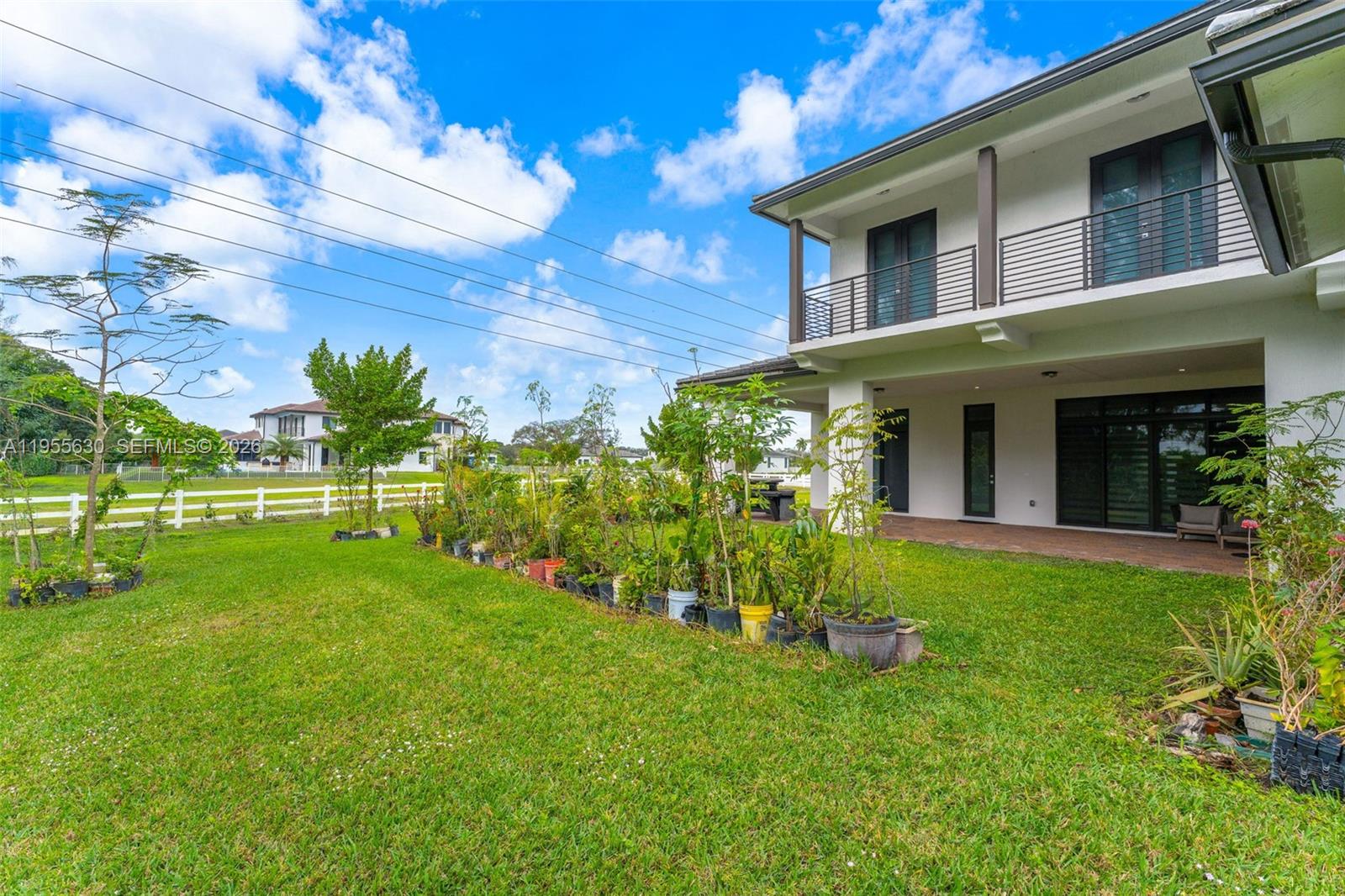 4950 Southwest 158th Ave Ranches Southwest Ranches, FL 33331 - Photo 61 of 75 a view of a house with a yard