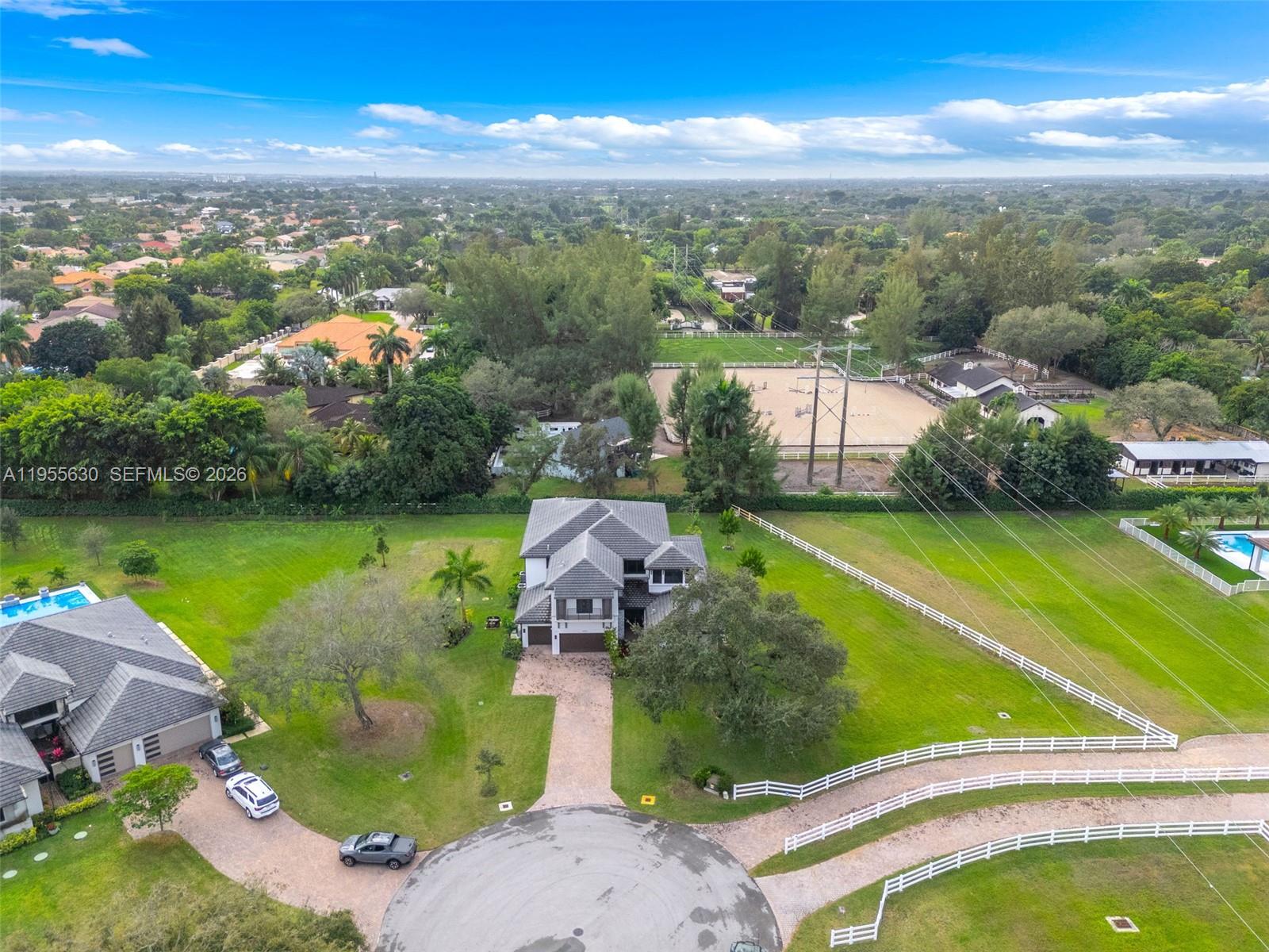 4950 Southwest 158th Ave Ranches Southwest Ranches, FL 33331 - Photo 65 of 75 an aerial view of a house with a garden and lake view