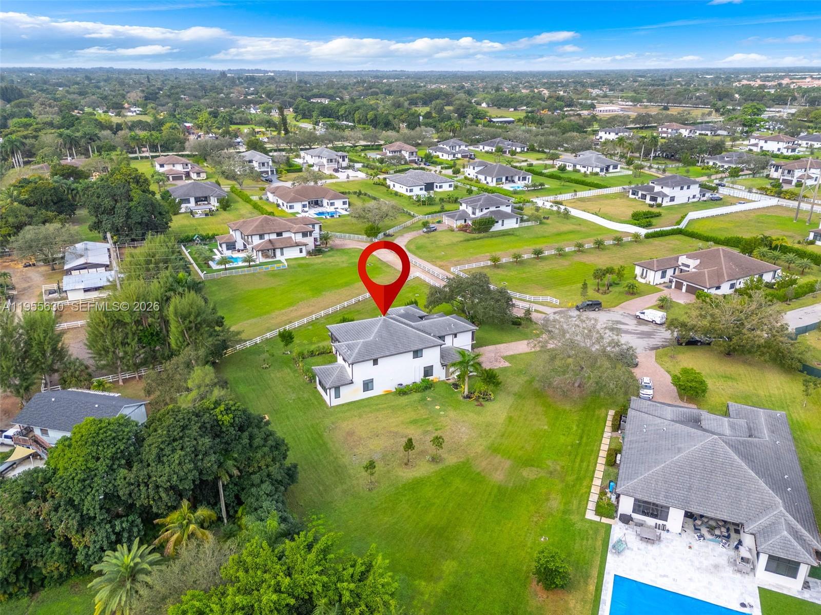 4950 Southwest 158th Ave Ranches Southwest Ranches, FL 33331 - Photo 70 of 75 an aerial view of residential houses with outdoor space