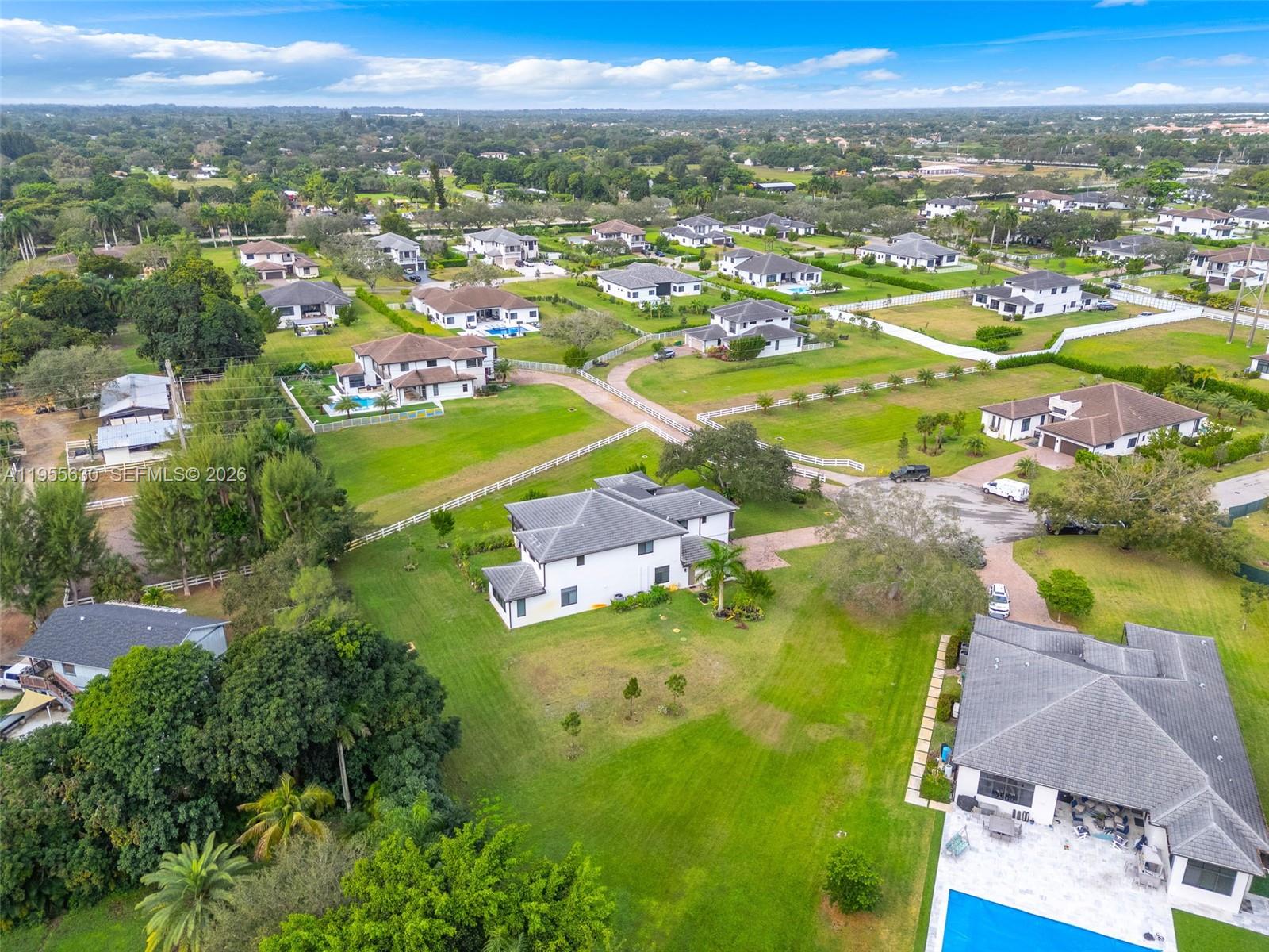 4950 Southwest 158th Ave Ranches Southwest Ranches, FL 33331 - Photo 71 of 75 an aerial view of residential houses with outdoor space and river