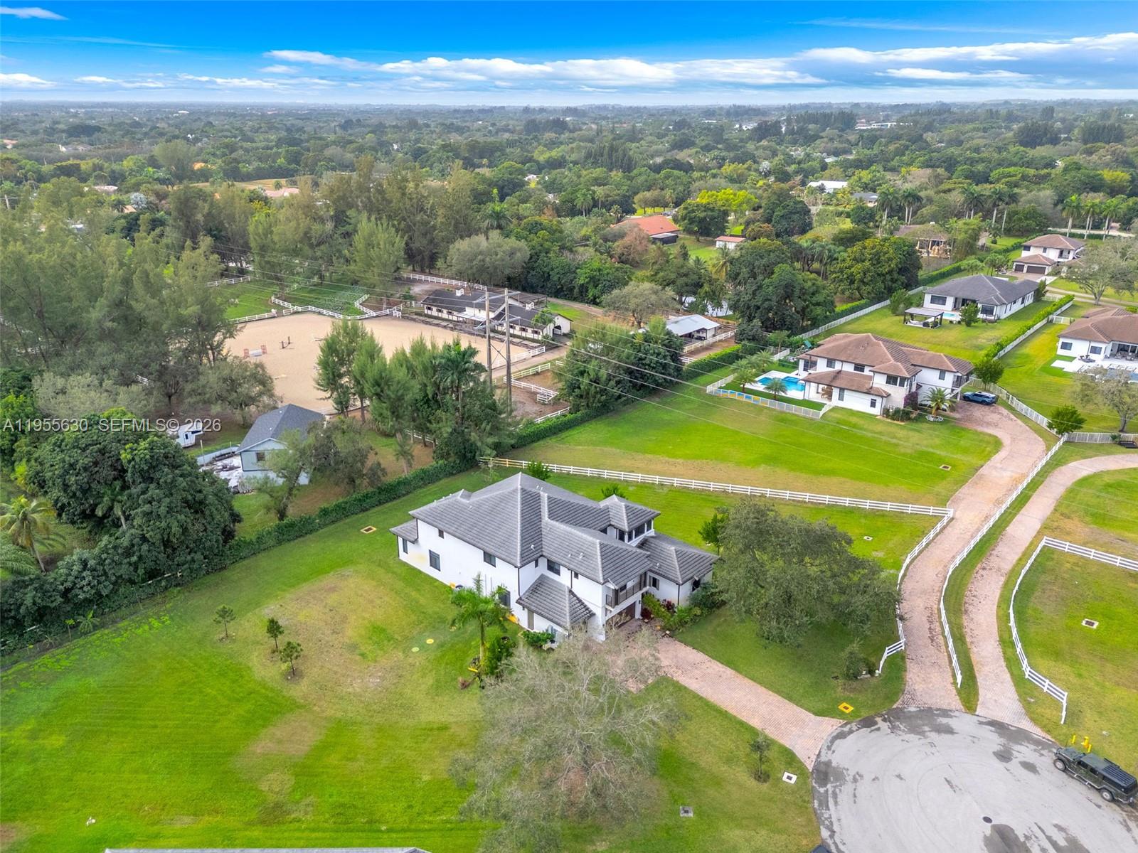 4950 Southwest 158th Ave Ranches Southwest Ranches, FL 33331 - Photo 73 of 75 an aerial view of a residential houses with outdoor space and a lake view
