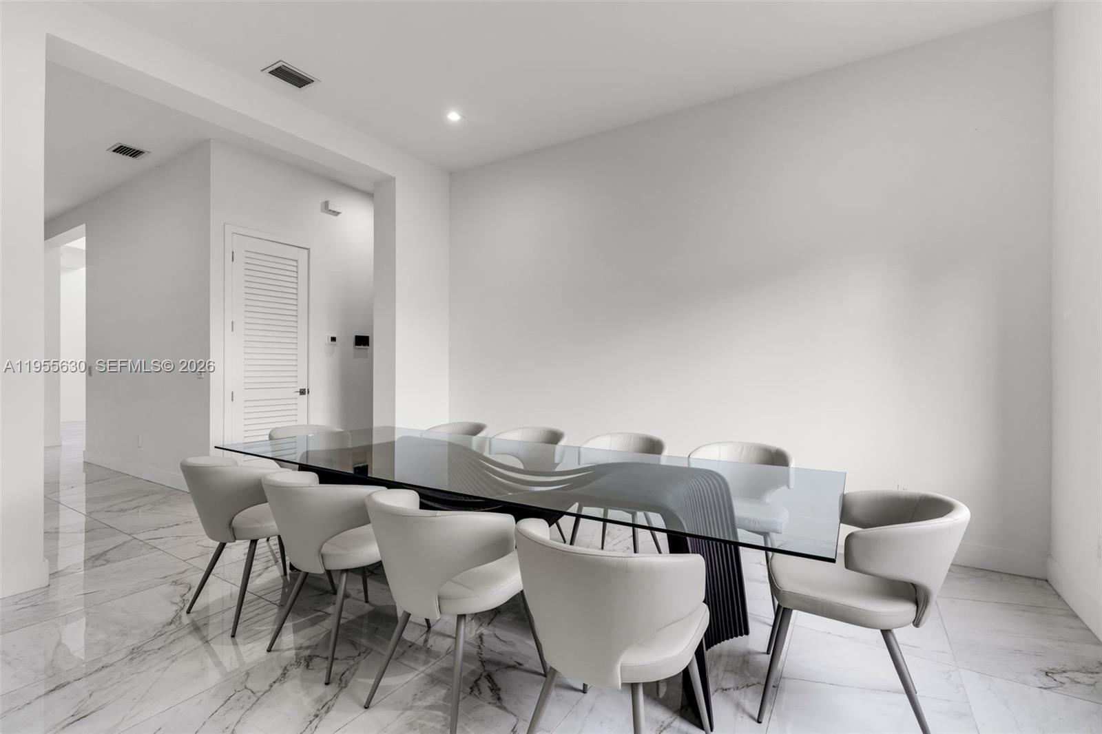 4950 Southwest 158th Ave Ranches Southwest Ranches, FL 33331 - Photo 9 of 75 a view of a dining room with furniture and wooden floor