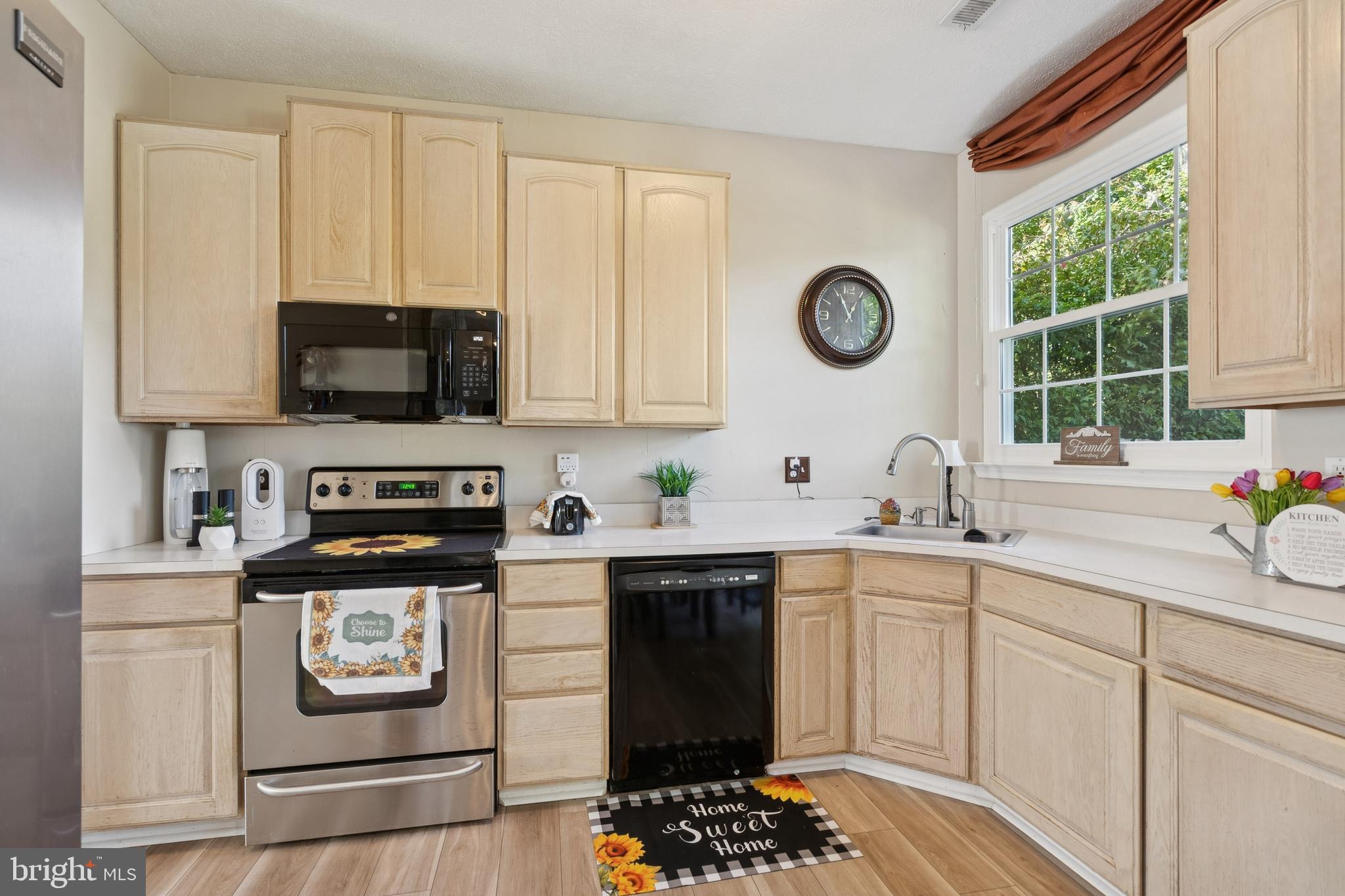 7 Meadowbrook Drive Westampton, NJ 08060 - Photo 11 of 25 a kitchen with stainless steel appliances granite countertop a stove a sink and a microwave