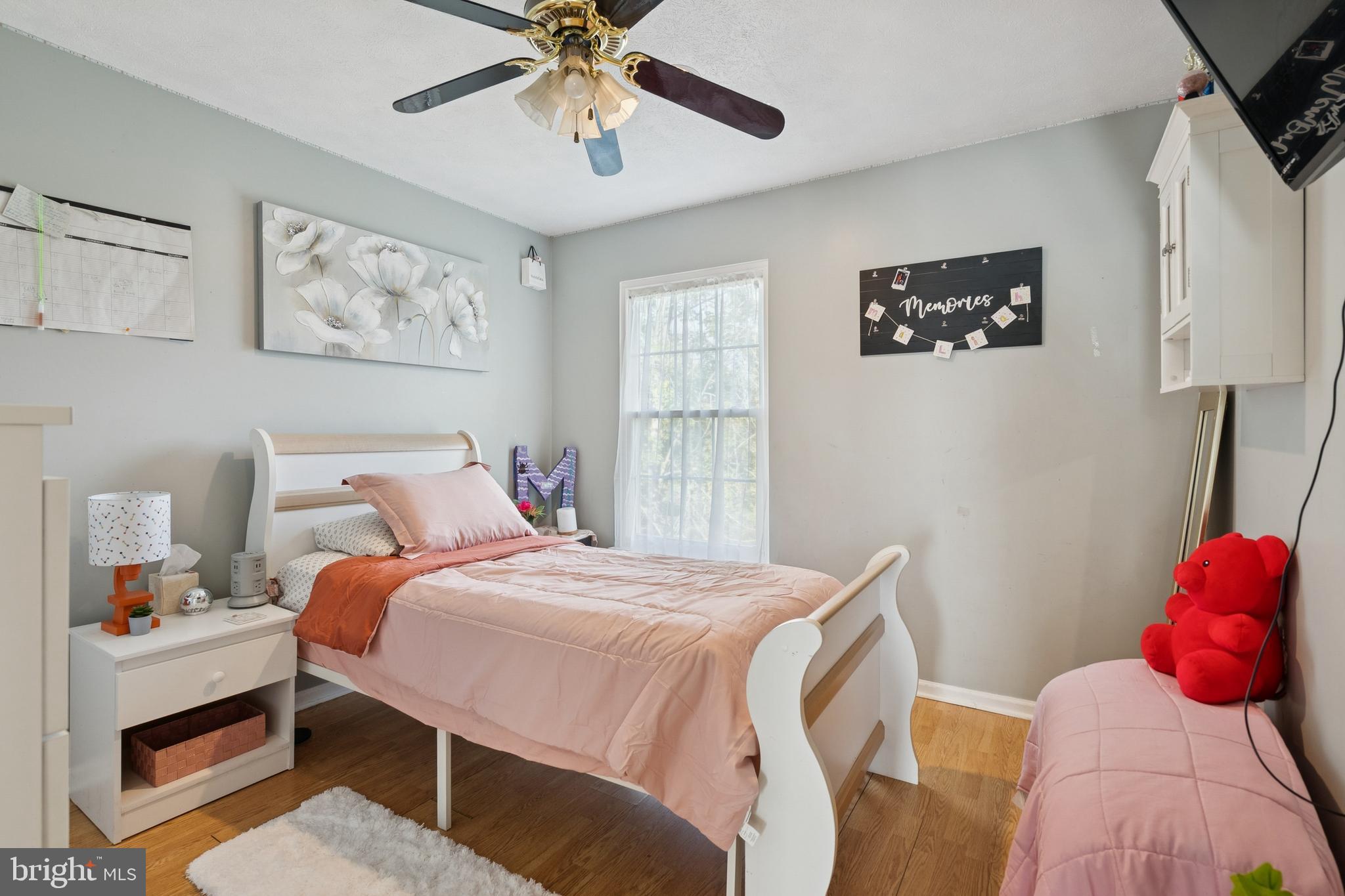 7 Meadowbrook Drive Westampton, NJ 08060 - Photo 21 of 25 a bedroom with a bed and a chandelier