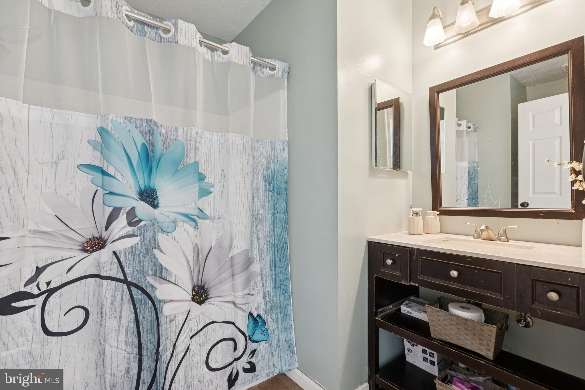 7 Meadowbrook Drive Westampton, NJ 08060 - Photo 23 of 25 a bathroom with a double vanity sink and a mirror
