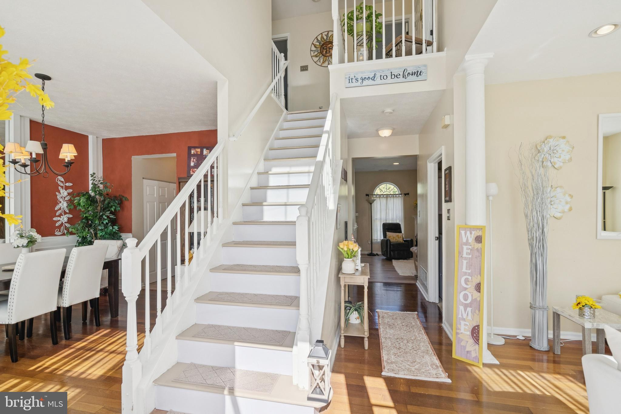 7 Meadowbrook Drive Westampton, NJ 08060 - Photo 3 of 25 a view of staircase with lots of frames and frames on wall and windows