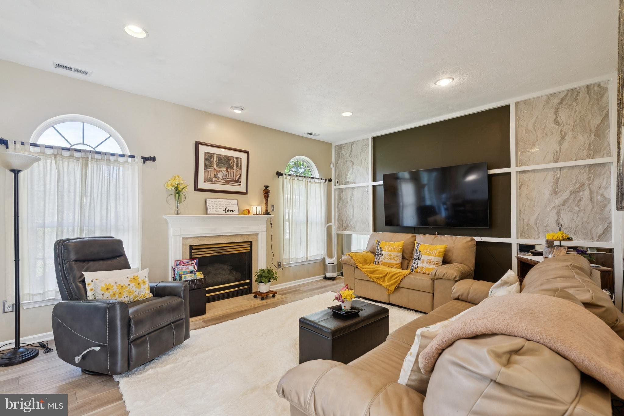 7 Meadowbrook Drive Westampton, NJ 08060 - Photo 7 of 25 a living room with furniture and a fireplace