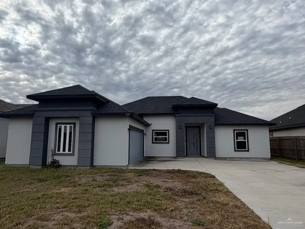 a house with yard in front of it