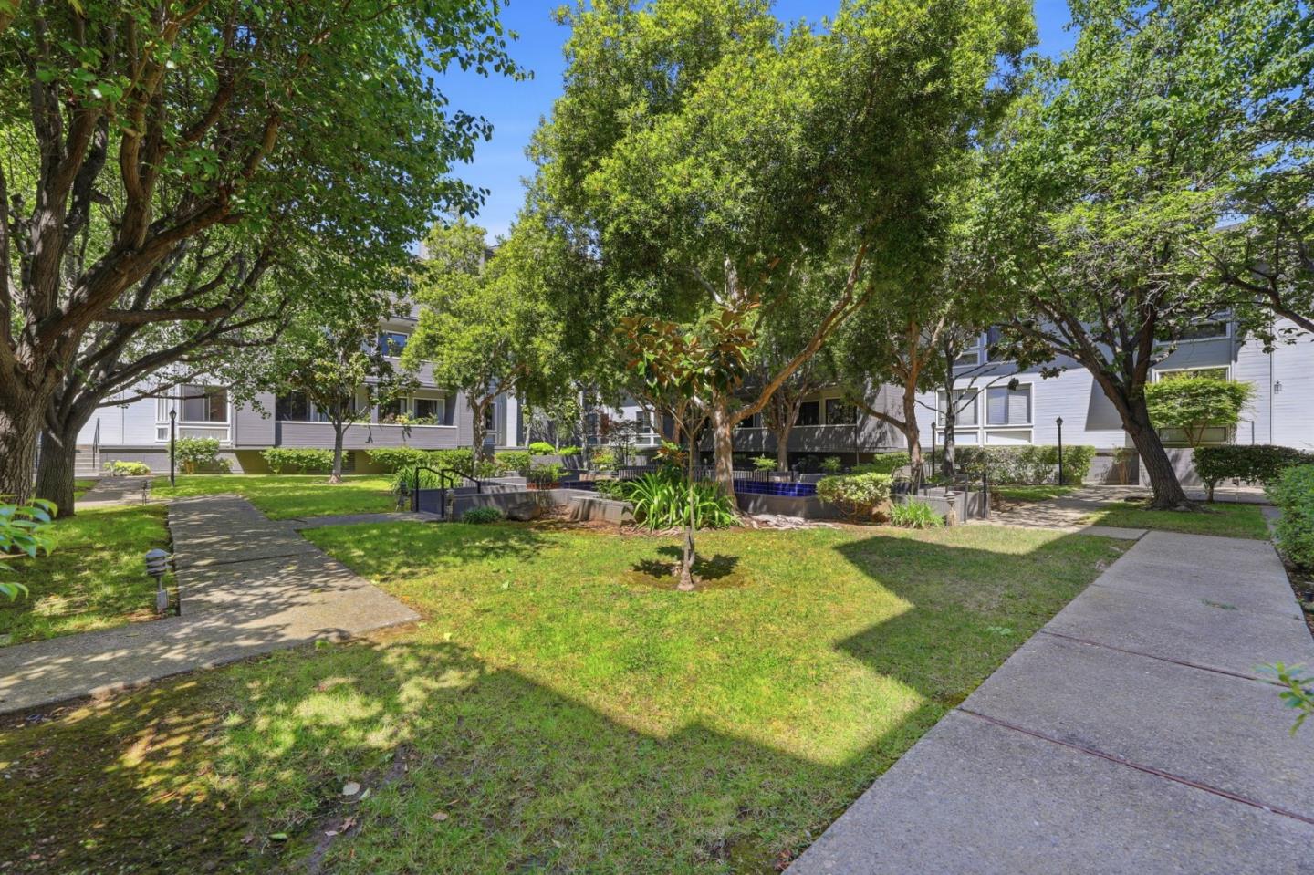 22330 Homestead Road, Unit 226 Cupertino, CA 95014 - Photo 37 of 38 a view of a house with garden and trees
