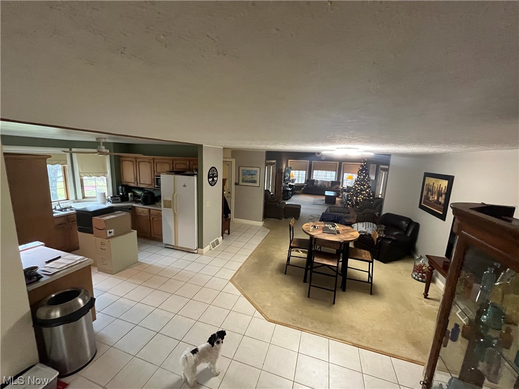 72895 Irish Ridge Road Kimbolton, OH 43749 - Photo 18 of 21 Dining space featuring light tile floors