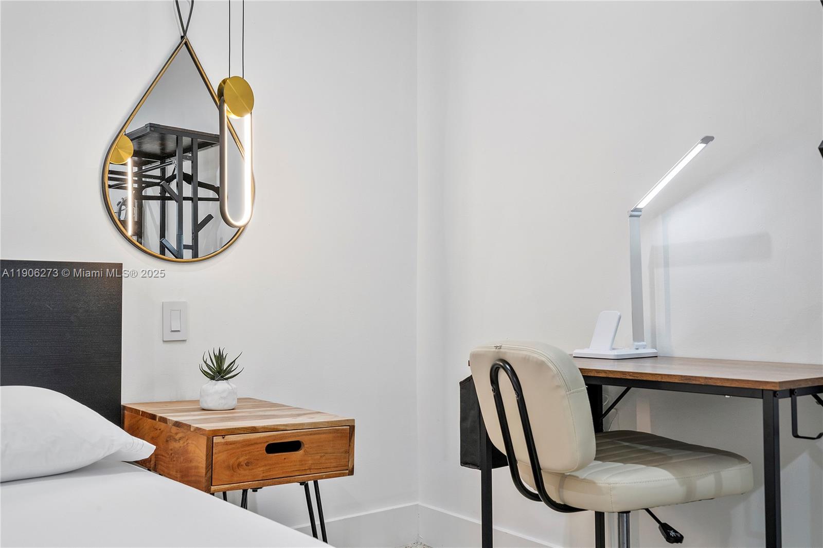 256 Northwest 57th Street Miami, FL 33127 - Photo 12 of 45 a view of a workspace with furniture