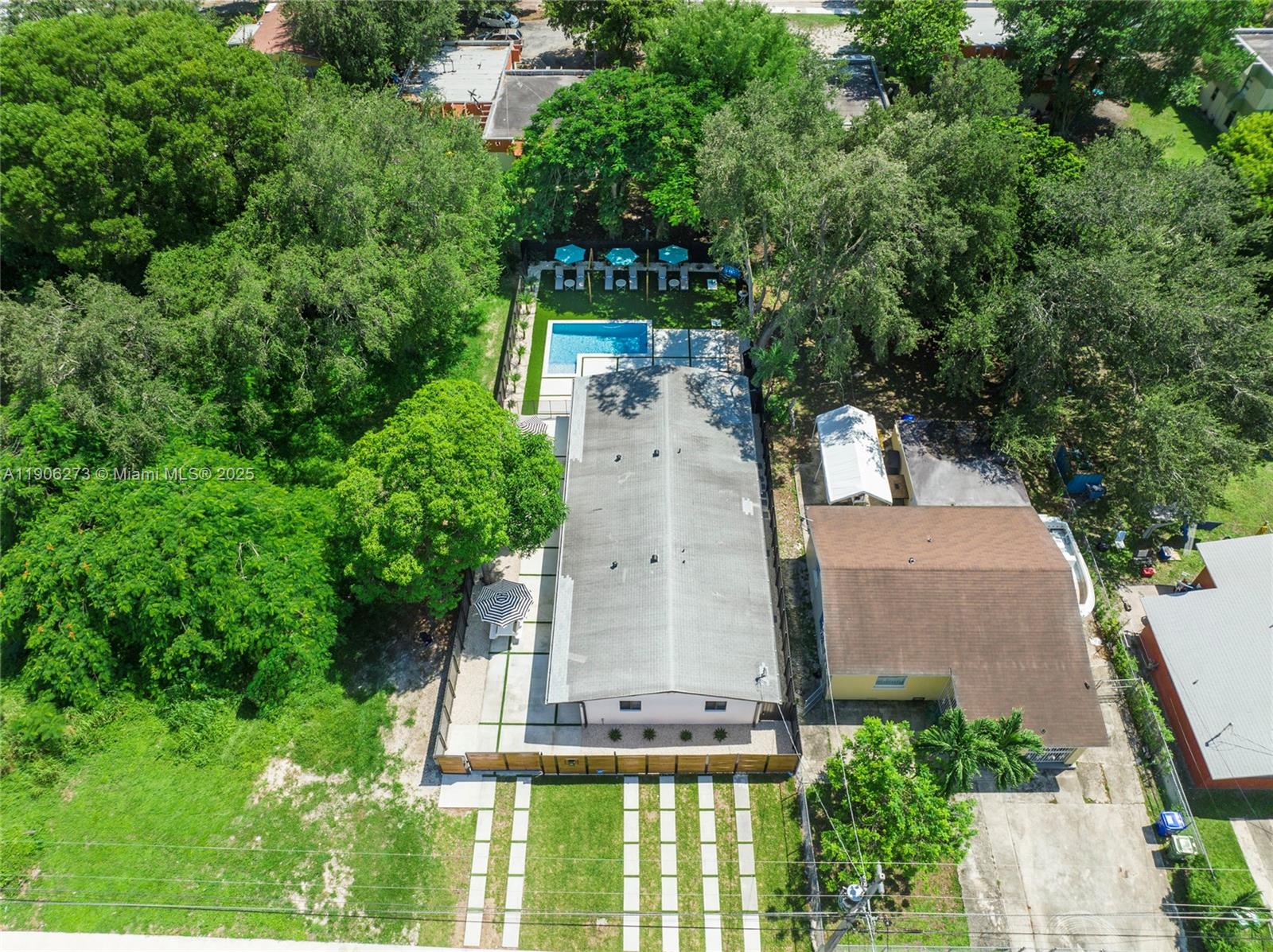 256 Northwest 57th Street Miami, FL 33127 - Photo 18 of 45 an aerial view of a house with a garden