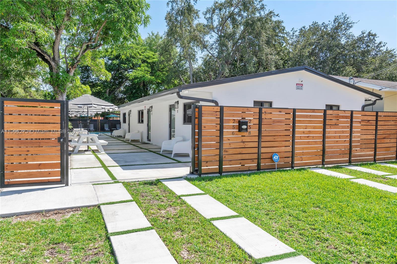 256 Northwest 57th Street Miami, FL 33127 - Photo 3 of 45 a view of a backyard with a garden