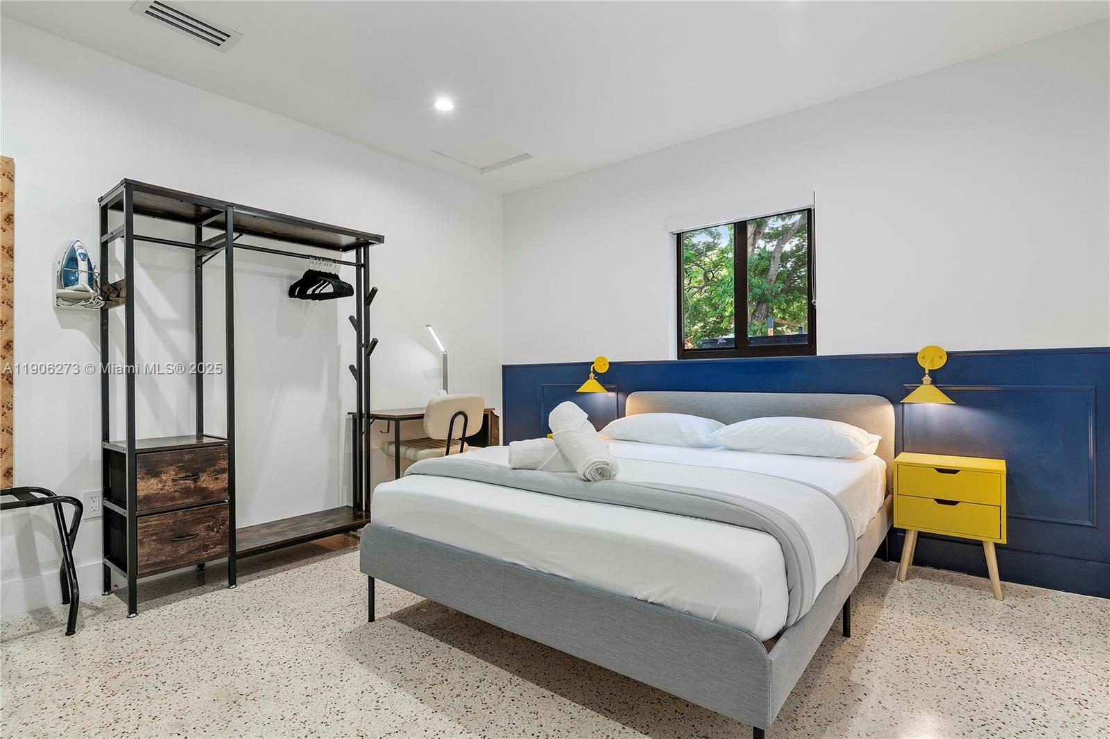 256 Northwest 57th Street Miami, FL 33127 - Photo 33 of 45 a bedroom with a bed and a walk in closet