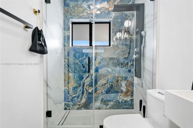 a kitchen with kitchen island wooden cabinets and stainless steel appliances