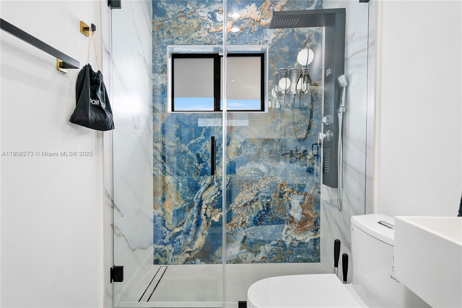 256 Northwest 57th Street Miami, FL 33127 - Photo 36 of 45 a bathroom with a bathtub and shower