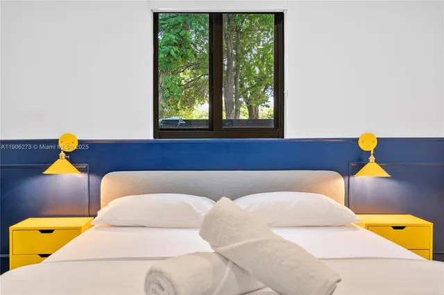 a front view of house with yard outdoor seating and green space