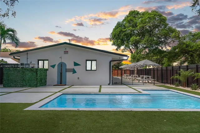 a front view of house with yard patio and seating space