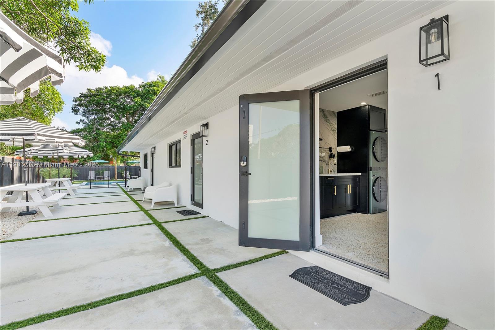 256 Northwest 57th Street Miami, FL 33127 - Photo 5 of 45 a view of a house with sitting area