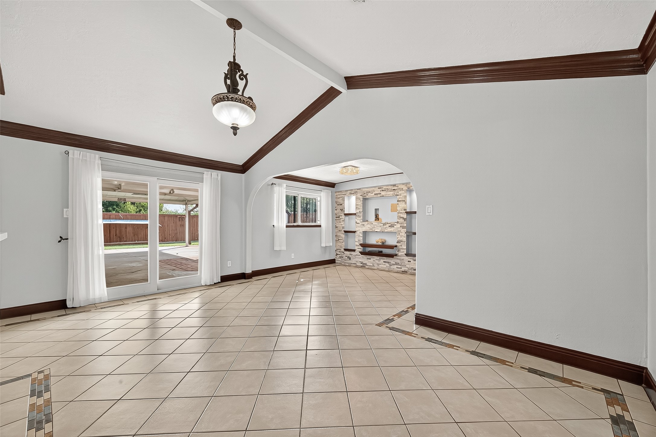 14007 Buffalo Speedway Houston, TX 77045 - Photo 13 of 46 a view of a livingroom with wooden floor and a ceiling fan