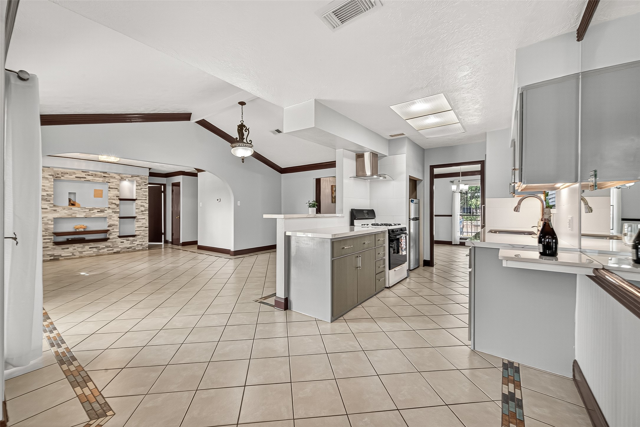 14007 Buffalo Speedway Houston, TX 77045 - Photo 17 of 46 a large white kitchen with cabinets