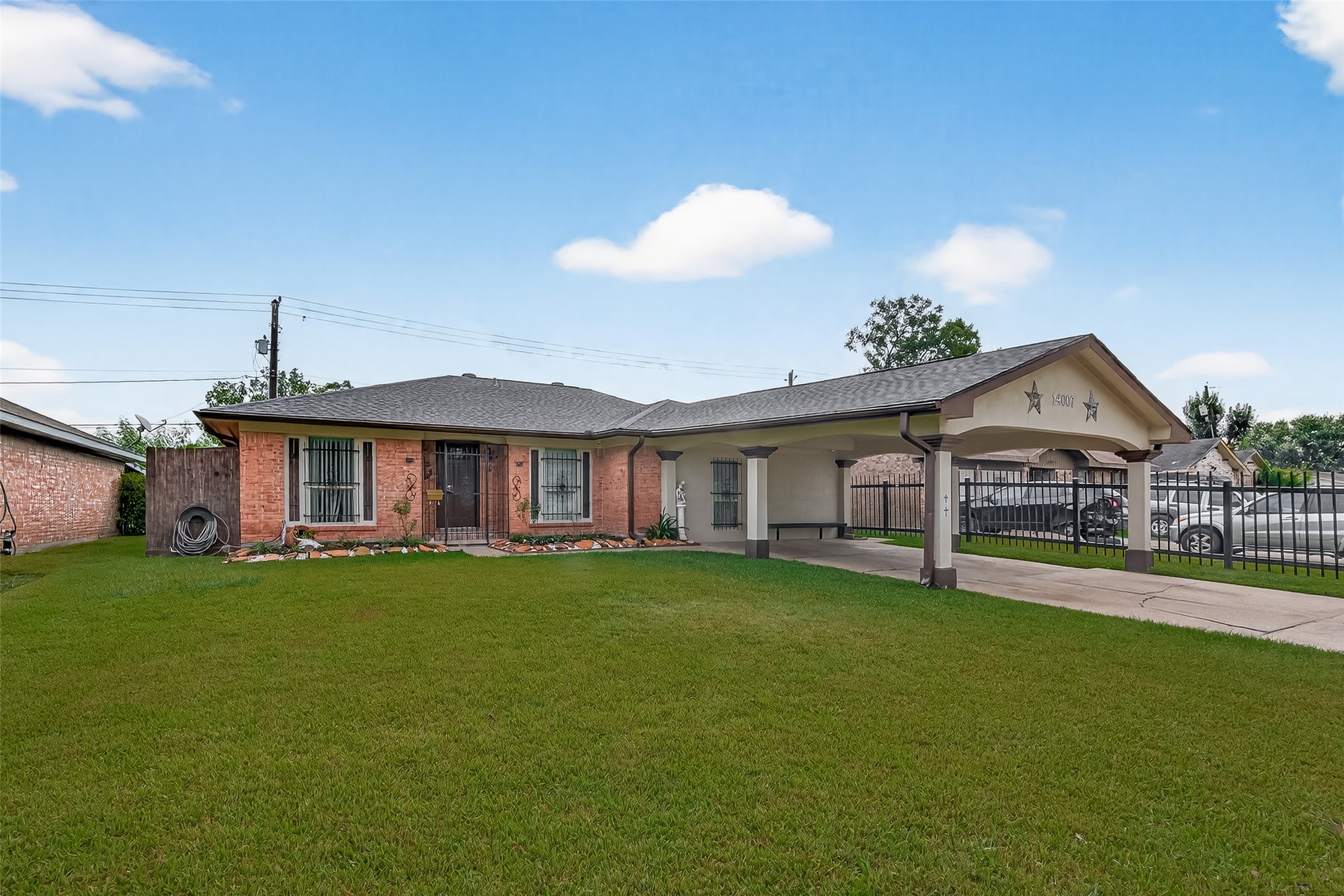 14007 Buffalo Speedway Houston, TX 77045 - Photo 2 of 46 a front view of a house with a garden